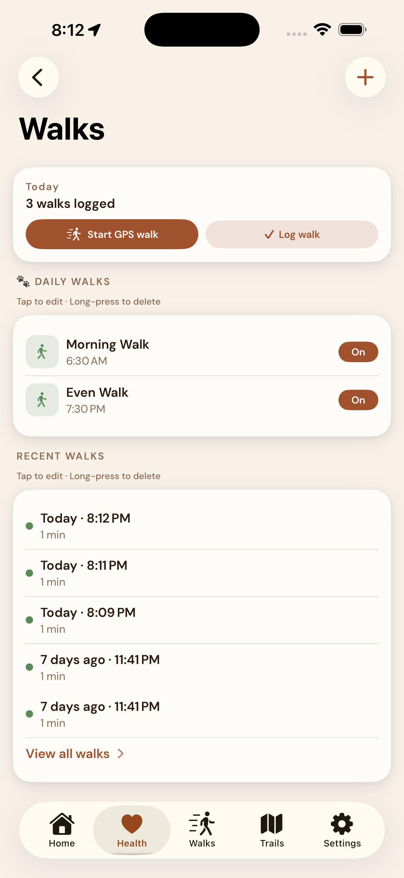 EmberPaws Walks hub — a copper Start GPS walk button next to Log walk, a count of three walks logged today, scheduled Daily Walks (Morning Walk at 6:30 AM and Evening Walk at 7:30 PM, each with an on/off toggle), and a Recent Walks list with a View all walks link.